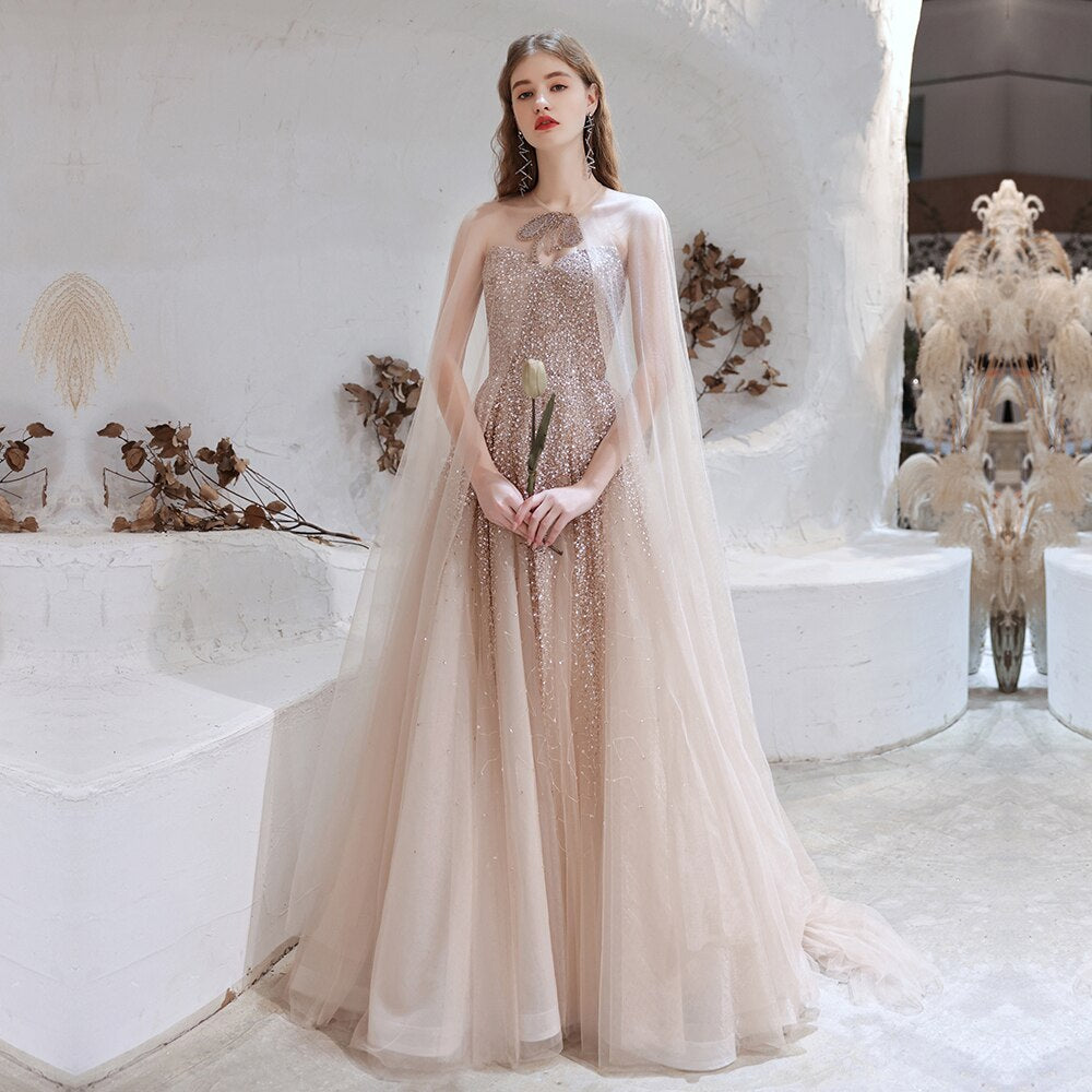 Blush Wedding Dress With Removable Wedding Cape and Crystal Embellishments - June